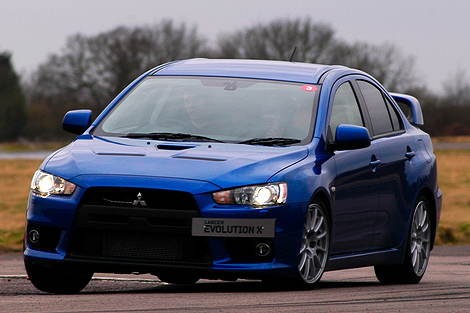 Mitsubishi Evo X rolls in a corner